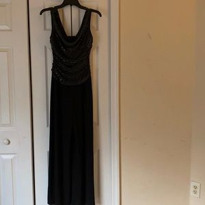 This is a black mixed with a little bit of silver, size 4, jumpsuit